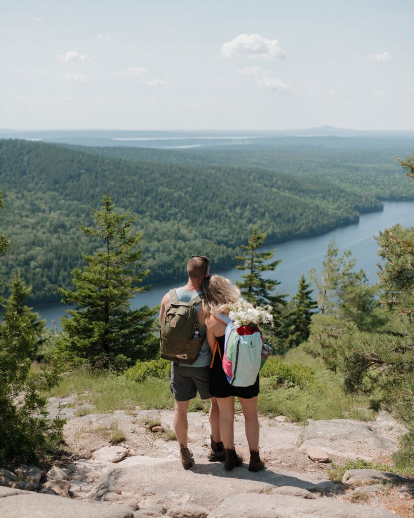 elopement couple hiking in acadia national park to share their vows