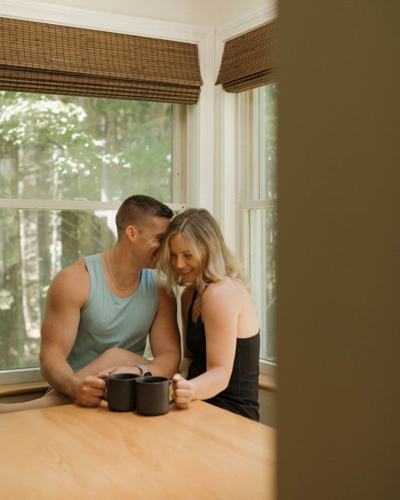 couple at airbnb sharing romantic breakfast before eloping in acadia national park