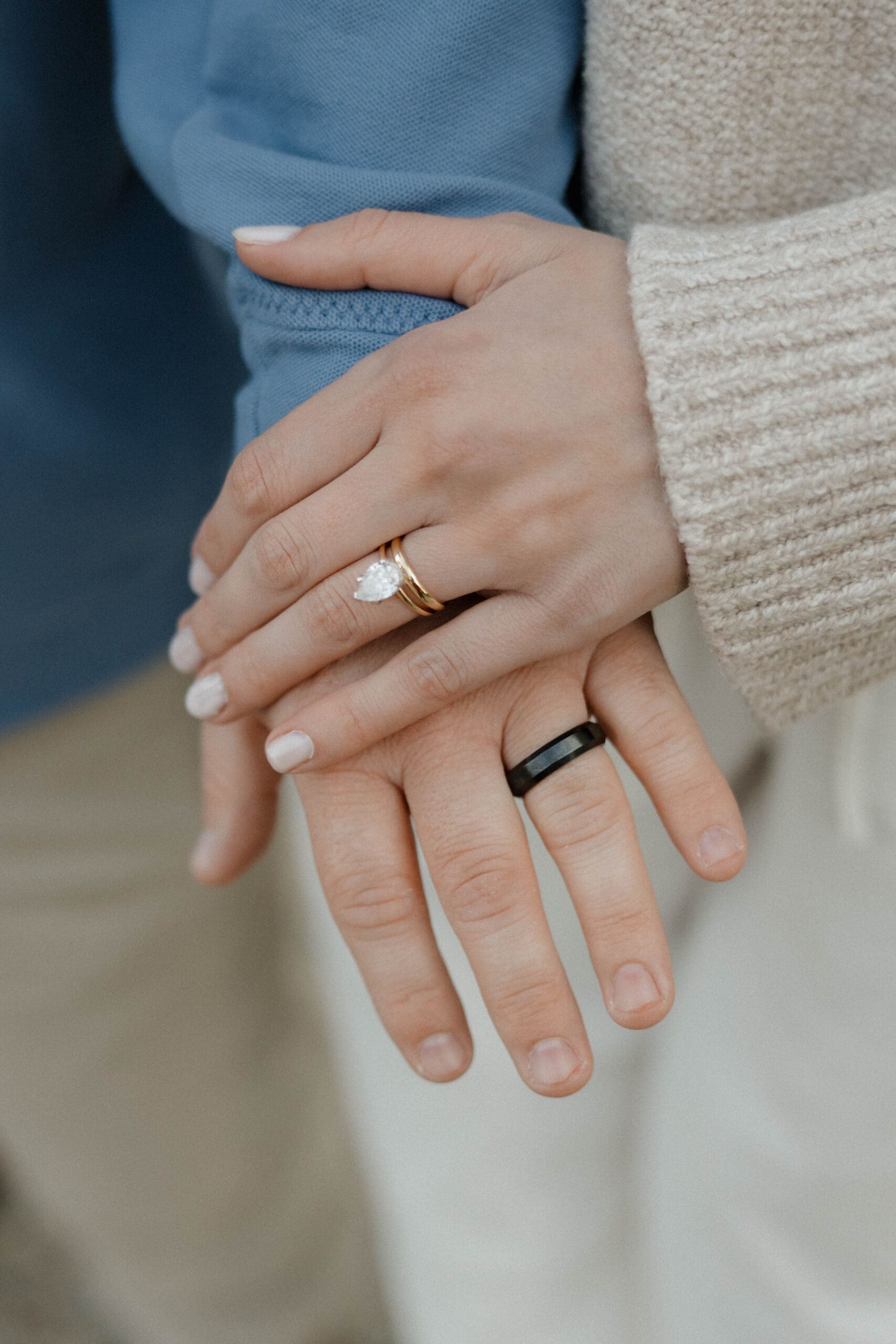 couple eloping in glacier national park showing off their rings