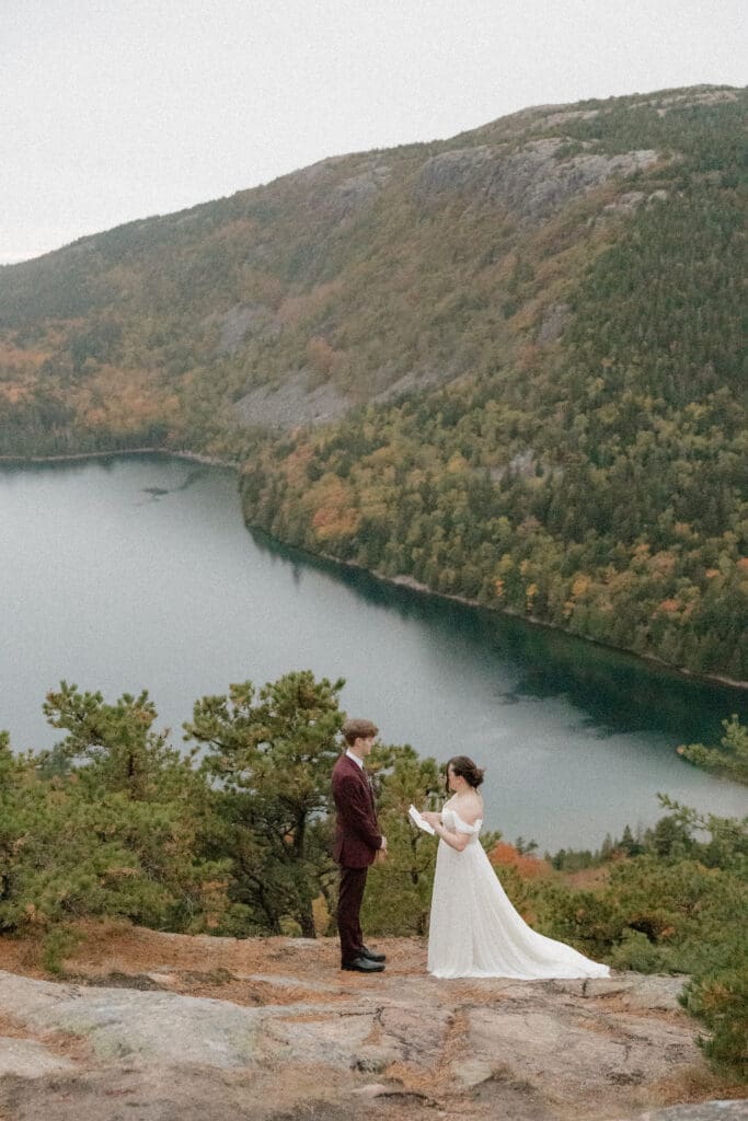 couple sharing private vows on north bubble mountain trail in acadia